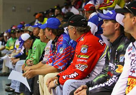 Anglers listen intently as B.A.S.S. Tournament Director Trip Weldon calls the meeting to order. 