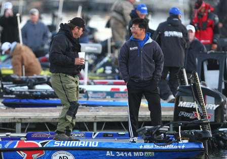Kota Kiriyama gives Greg Hackney a ride out to his boat in the middle of the cove.