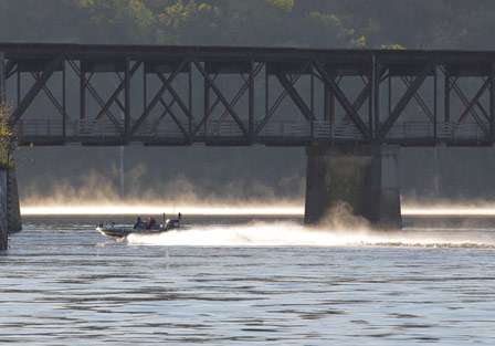 A boat runs under a bridge not far from take-off on Pickwick Lake.