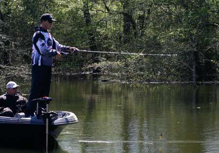 Near the back of the slough, Andy Montgomery makes a cast around the shoreline cover.