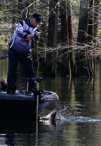 The bass tries to jump near the trolling motor, but Montgomery has other ideas.