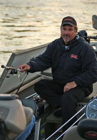 Pete Ponds pulls his rods from the locker to get ready for a day of fishing.