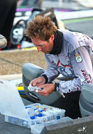 Travis Manson looks through his tackle box on Day Two of the Alabama Charge.