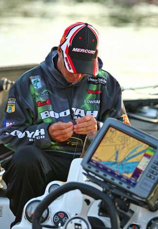 Terry Butcher rigs a few rods for another day of fishing on Pickwick Lake.