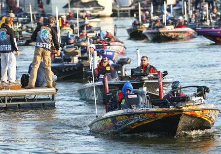 Matt Herren and a line of Elite Series boats idle out onto Lake Pickwick Thursday.