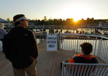 A few fans watch from the shore as their favorite anglers gather for the second day of fishing.