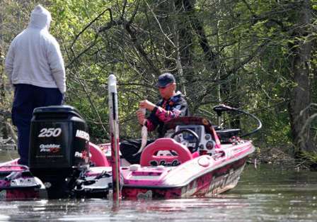 Kevin Short puts a solid keeper largemouth on the scales to cull one of his smaller fish on Day Two.