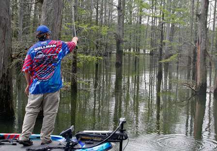 Rookie Nate Wellman makes a long pitch to a cypress tree on Day Two.