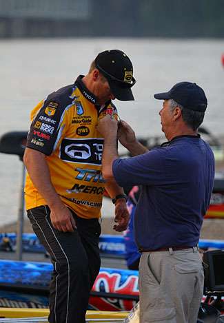 Scroggins gets miked up for the final day of fishing.