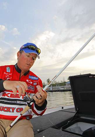Anglers have time for a few last-minute adjustments, as Kelly Jordon here puts new line on his reel.