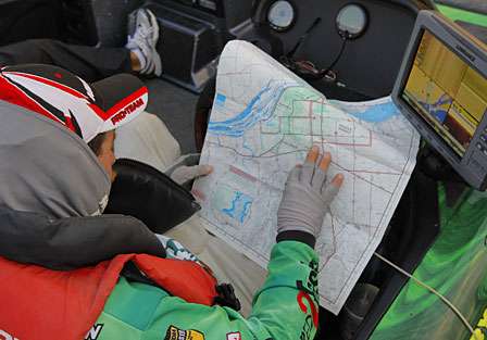 Shaw Grigsby looks at a map of the lake before launch.