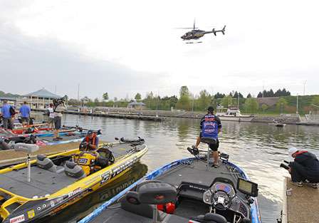 Anglers wait as the helicopter circles the marina on Pickwick Lake.