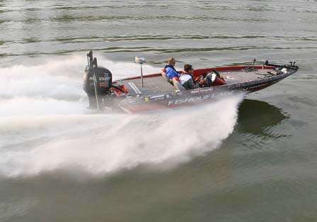 Greg Hackney fights his way through boat waves Saturday morning as he runs down river.