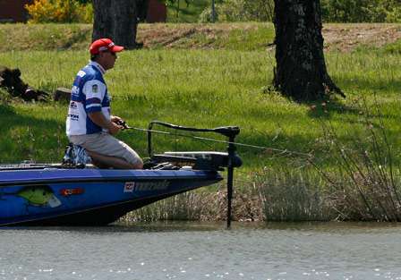 Kneeling on the deck of his boat allows Alton Jones to maintain a low profile while sight fishing.