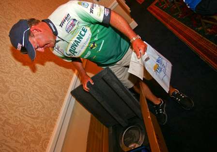 Davy Hite takes a peek at the trophy he won last week at Pickwick. 
