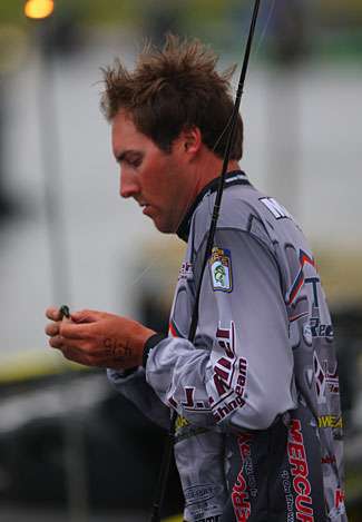 Travis Manson rigs his line as Day One gets under way.