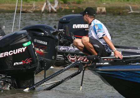 Randy Howell perches on the bow of his boat before making the plunge.