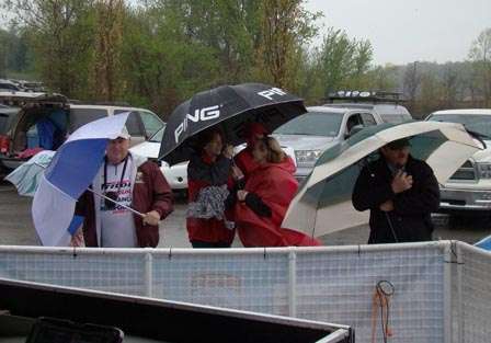 Besides providing protection from the rain, umbrellas helped shield folks from a cold wind.