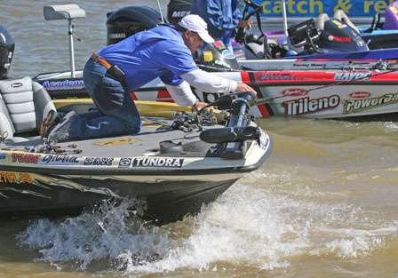 Terry Scroggins' Marshal attempts to balance with waves rocking the boat as they pull up to the dock Friday.