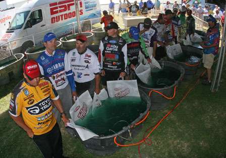 Elite anglers wait behind the stage for their opportunity to weigh in.