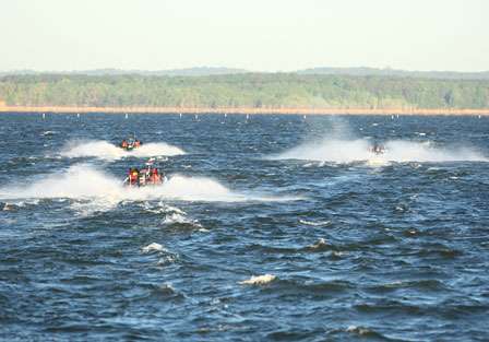 Boats fight waves that have built for the last two days on take-off Saturday.
