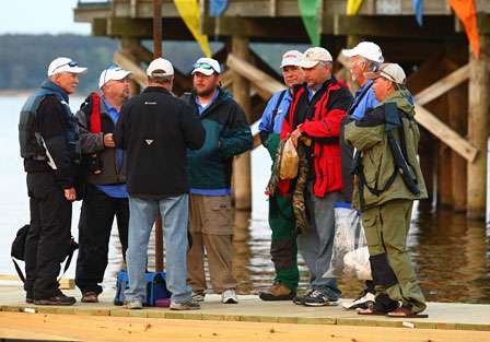 Marshals gather on the dock with tournament officials for a morning meeting.