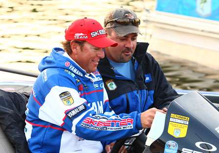 Dean Rojas shows Mark Zona where he will be fishing on Sunday morning.