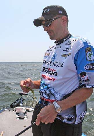 After a quick cull, Howell readjusts his Carolina-rigged lizard and hits the area again.
