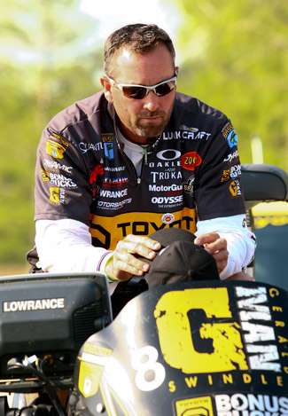 Gerald Swindle waits in his boat before they pull him up to stage to weigh his catch.