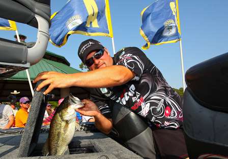 Fred Roumbanis gets ready to show his big fish to the crowd.