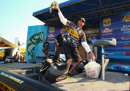 Gerald Swindle holds his biggest largemouth high as he prepares to bring his bag to the stage.
