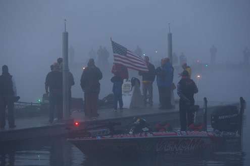 <p>
	Anglers and spectators remove their hats for the playing of the national anthem.</p>
