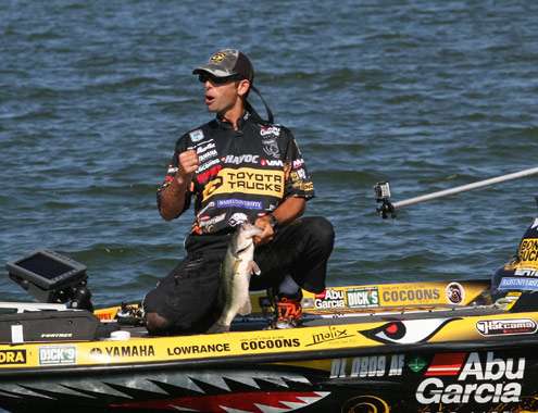 <p>
	Iaconelli is pumped to get this chunky largemouth into the boat.</p>

