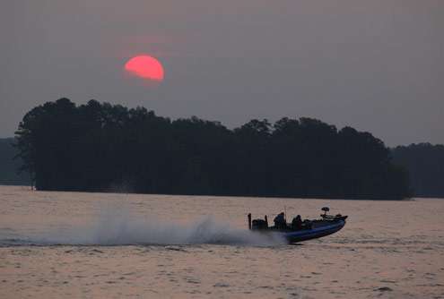 <p>
	An angler leaps a wave as the sun slowly rises over Lake Murray.</p>
