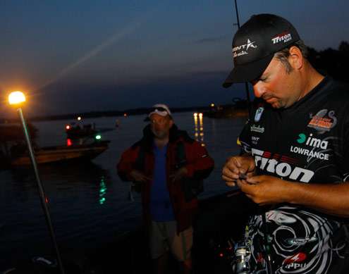<p>
	Fred Roumbanis works on his tackle before the Day Two take-off gets started.</p>
