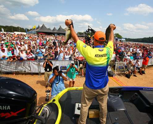 <p>
	Steve Kennedy holds up his two big largemouth as the huge La Grange, Ga., crowd looks on.</p>

