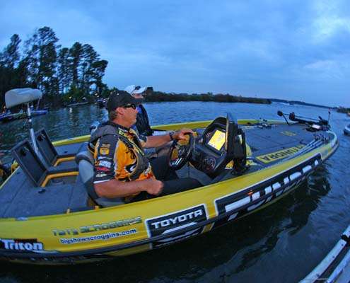 <p>
	Terry Scroggins, who took the lead in the Toyota Tundra Bassmaster Angler of the Year race on Friday, passes the take-off dock Saturday morning.</p>
