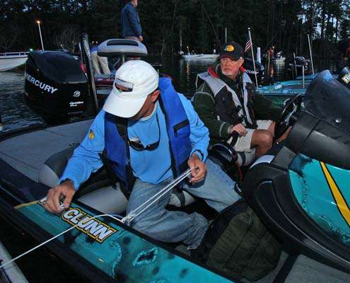 <p>
	Rick Clunn watches as his Marshal ties his boat to the dock.</p>
