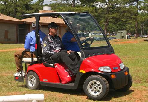 <p>
	Aaron Martens hitches a ride to the stage on a golf cart on Day Two of the Pride of Georgia.</p>
