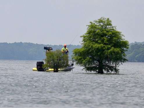 <p>
	Steve Kennedy fishes around isolated cypress trees on humps and ridges on West Point Lake.</p>

