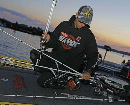 <p>
	Michael Iaconelli prepares his rods, four spinning and one baitcasting, prior to the start of the final day.</p>
