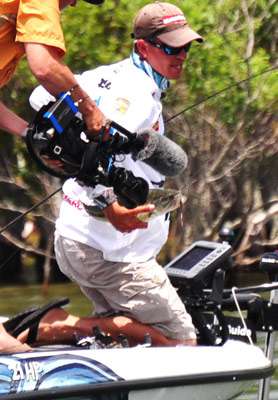 <p>
	Ashley slings him into the boat by the belly as the camera films the action.</p>

