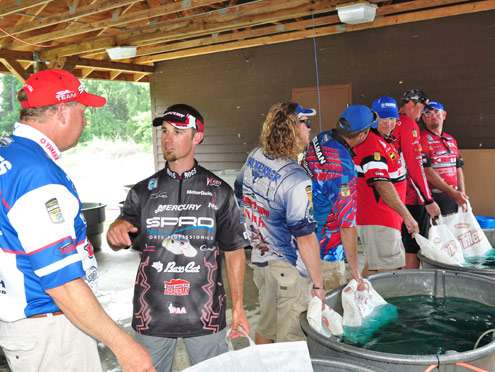<p>
	The tanks are full as anglers talk amongst themselves before taking to the stage.</p>

