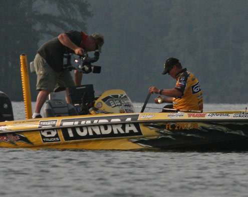 <p>
	Scroggins pulls out the bump board to measure this largemouth on Day Two of the Evan Williams Bourbon Carolina Clash.</p>
