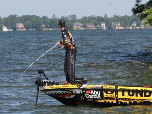 <p>
	Mike Iaconelli hooks up with a fish off a wood-covered point on Day Four of the Evan Williams Bourbon Carolina Clash on Lake Murray.</p>
