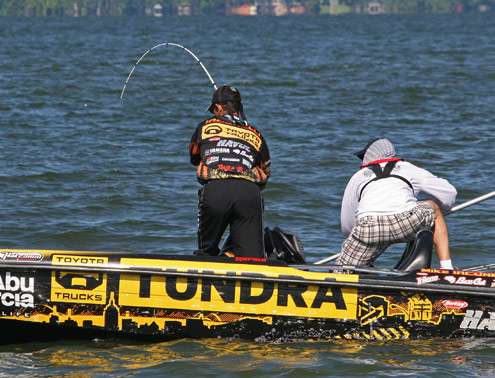 <p>
	With a cameraman looking on, Iaconelli plays the fish to the boat.</p>

