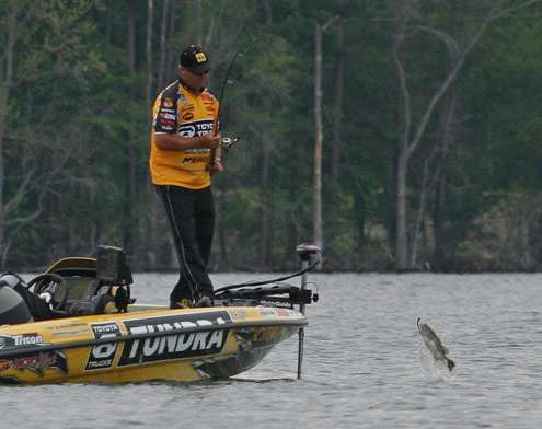 <p>
	Scroggins quickly hooks up again and catapults the bass to the boat.</p>
