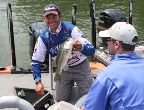 <p>
	James Niggemeyer is all smiles after catching this hefty Lake Murray bass.</p>
