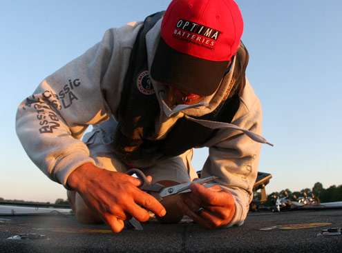 <p>
	Evers works on adding a new stinger hook to his swimbait.</p>
