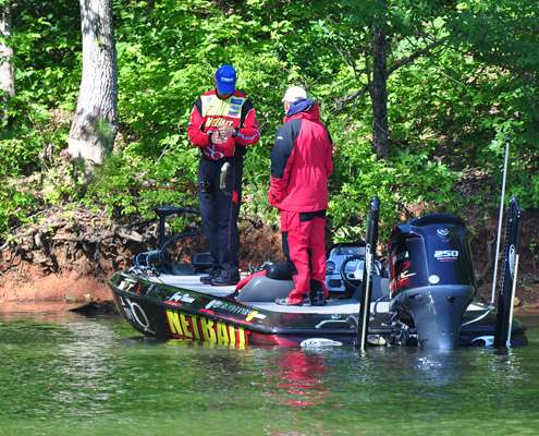 <p>
	Greg Vinson gets a strike from a small bass at midmorning ...</p>
